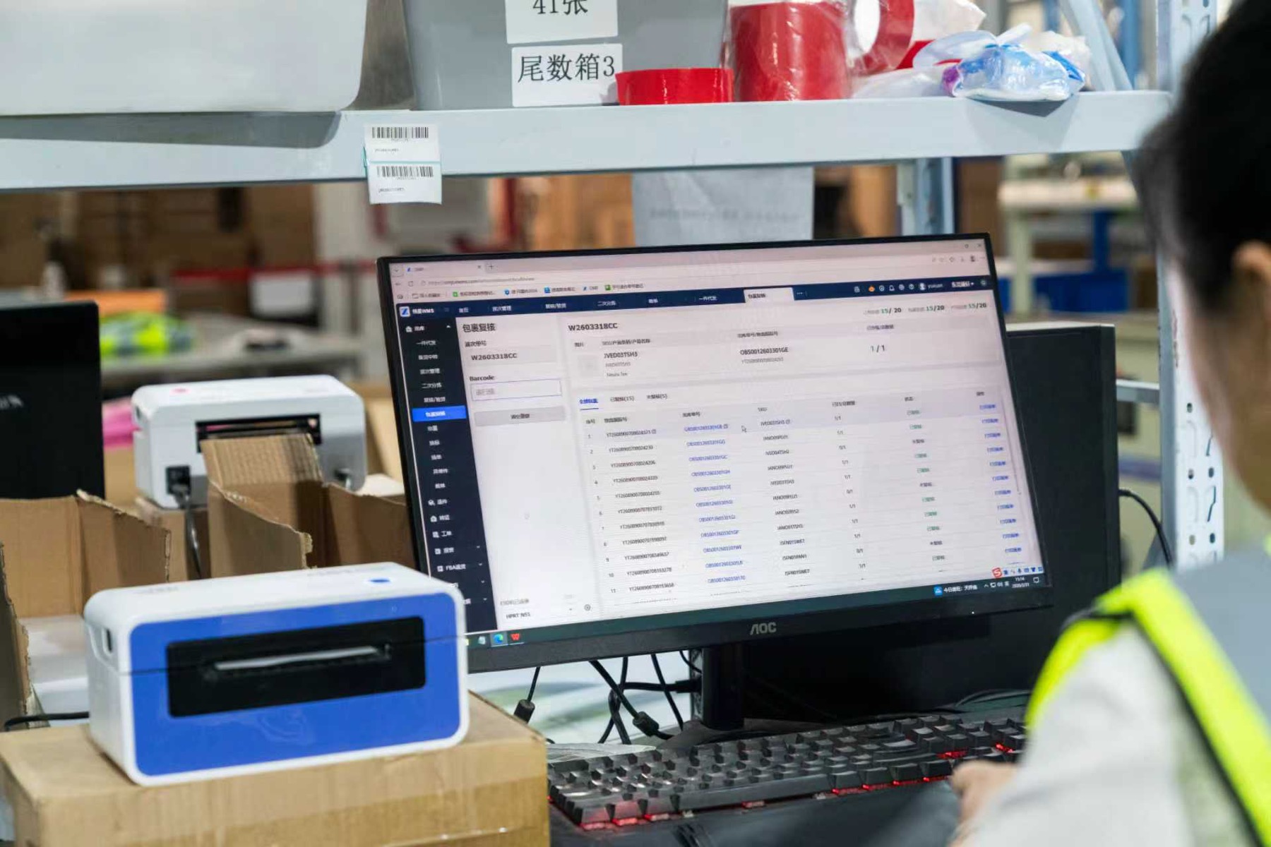 Warehouse system workstation with printer and packing area